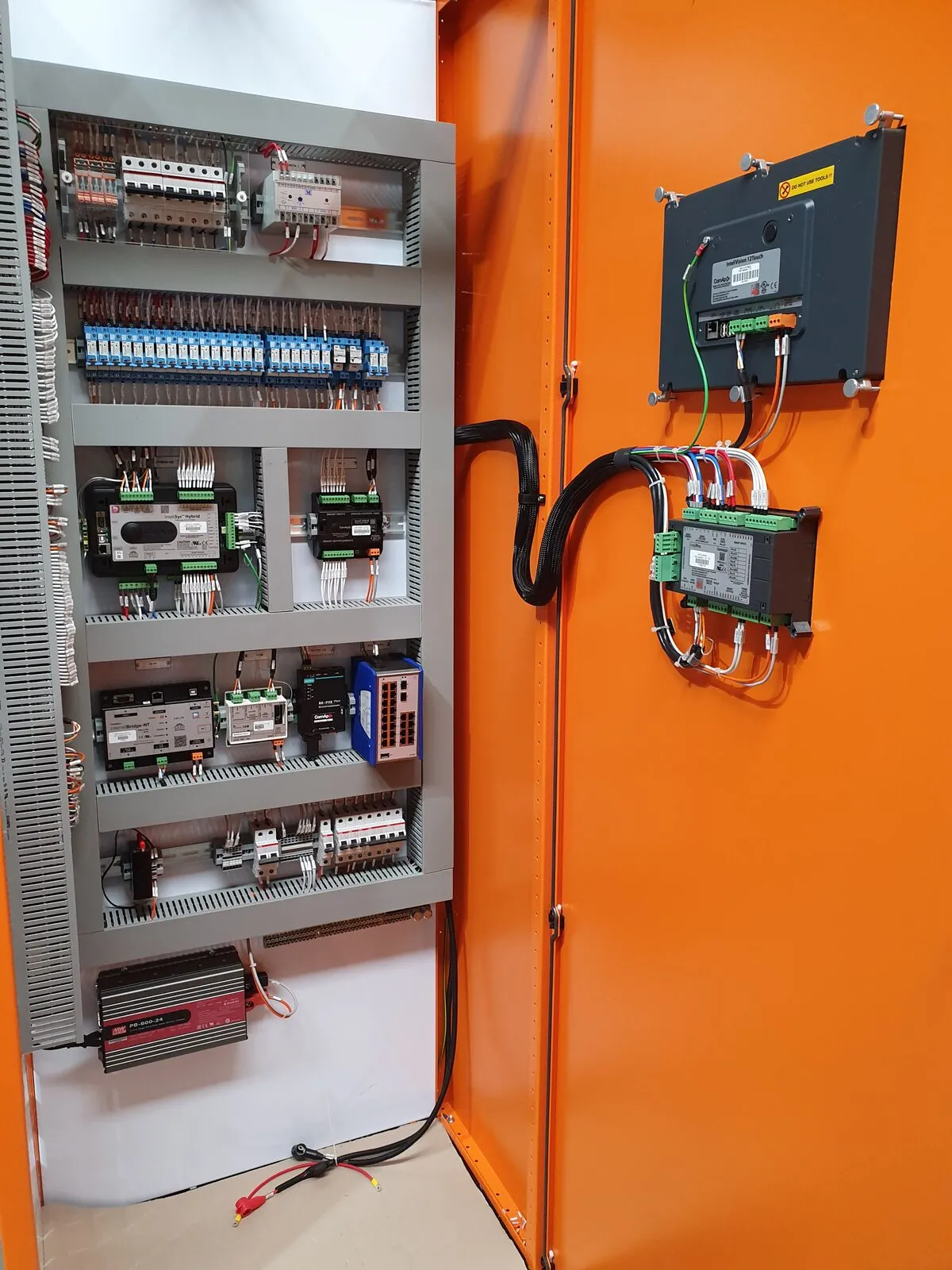 PLC control panel interior showing precision wiring and components